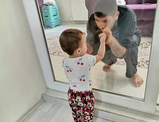 2 yaşındaki kızını camın arkasından seviyor