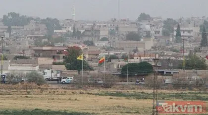 Sınırda terör bayrağı! YPG’li teröristler bez paçavralarını astı