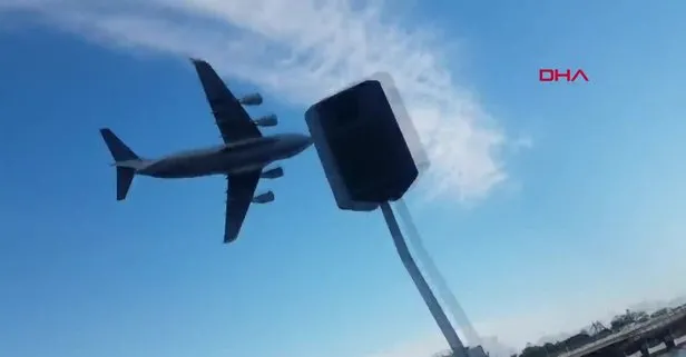Avustralya’da askeri kargo uçağı, gökdelenlerin arasında uçtu