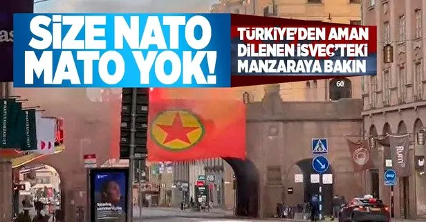 Teröristlere kucak açıp üstüne NATO için Türkiye’yi ikna etmeye çalışan İsveç’ten bir skandal daha: Başkente PKK paçavrası asıldı