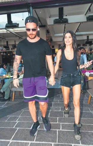 Burcu Kıratlı eşi Sinan Akçıl'ın adını boynunda taşıyor