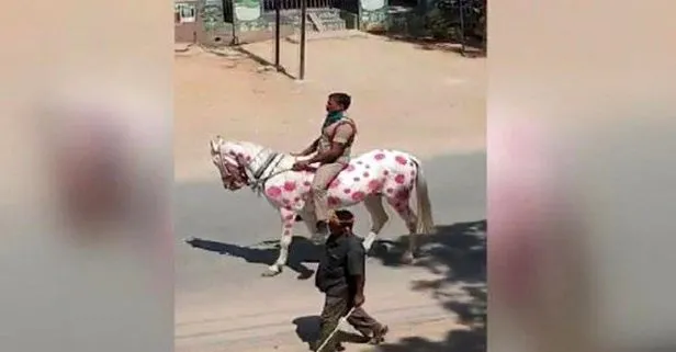 Hindistan polisinden ilginç önlem! Coronavirüs şekli çizdiği atı ile sokaklarda dolaştı...