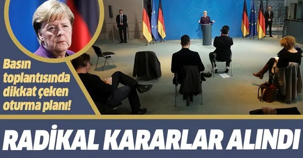 Merkel’in düzenlediği basın toplantısında dikkat çeken oturma düzeni