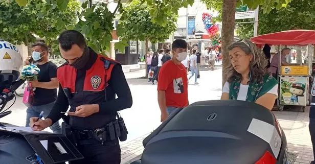 Maske takmamak için polise direnen kadın ceza yedi