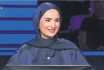 YKS çıkışı kızını çiçekle karşılamıştı! Çimen ve babası Kim Milyoner Olmak İster yarışmasında ekranları da ısıttı