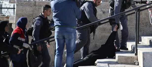 İsrailli subay Filistinli kadına yumruk attı