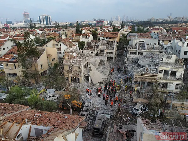 İran'dan İsrail'e misilleme! Füzeler yağdı binalar yıkıldı | İşte yıkımdan kareler - 9
