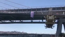 LGBTli sapkınların sözde Onur Yürüyüşünde skandal! DEM Partili Özgül Saki ve Kezban Konukçu Haliç Köprüsüne trans bayrağı astı