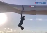 Fırtına pazarcıyı metrelerce havaya uçurdu
