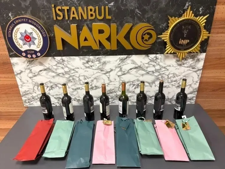 1783325083170.jpeg Havalimanında şarap görünümlü uyuşturucu trafiği! Şişedeki kristalleşme ele verdi-6
