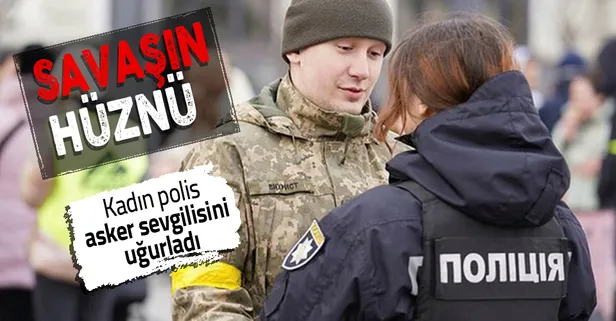 Rusya Ukrayna savaşında cephe yolunda hüzünlü anlar! Kadın polis asker sevgilisini böyle uğurladı