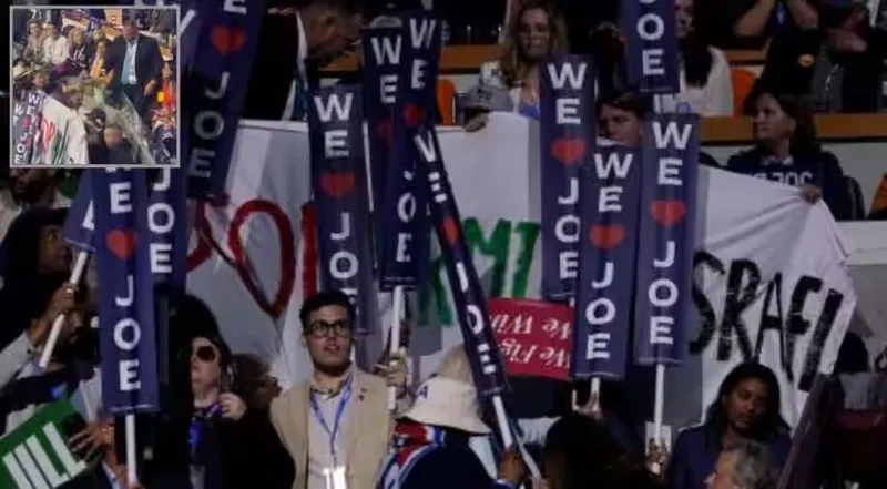 Salonda bulunan bazı kişiler ʺİsrail'i silahlandırmayı bırakınʺ yazılı bir pankart açtı.