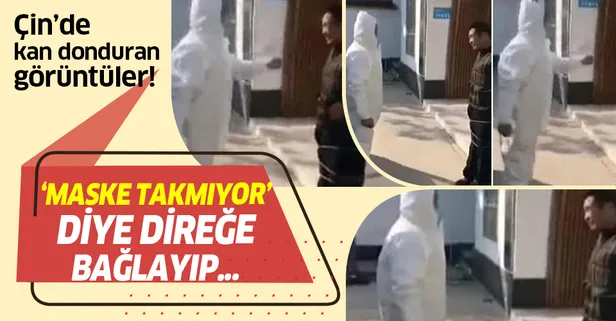 Çin'de kan donduran görüntüler! Maske takmayan köylüyü direğe bağlayıp...