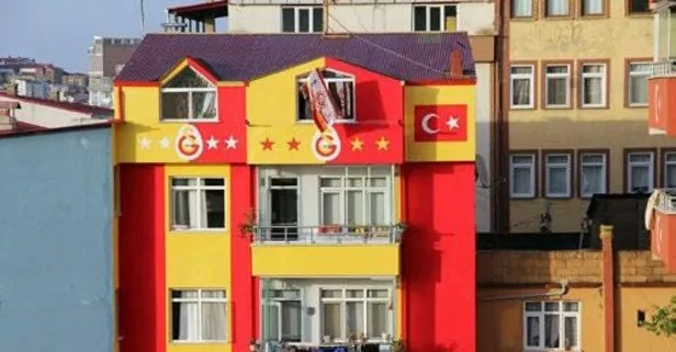 Oturduğu apartmanı sarı-kırmızı yaptı