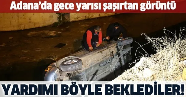 SON DAKİKA: Adana’da şaşırtan görüntü: Kanala uçtukları aracın üzerinde yardım beklediler