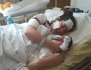 Bıçaklı saldırıya uğrayan anne bebeğini kucağına aldı
