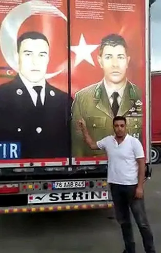 Gürcistan polisine direnen Türk şoför, TIR'daki milli kahramanların fotoğrafını söktürmedi!