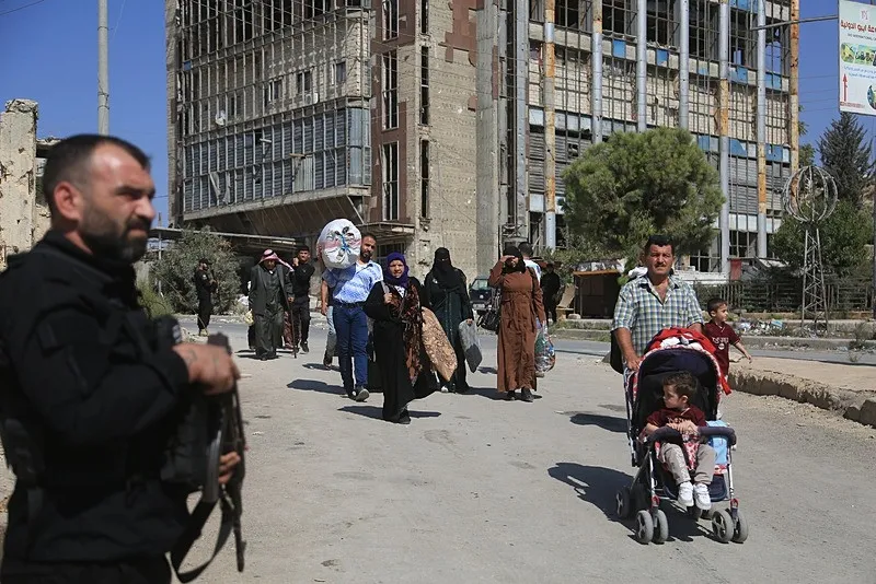 Suriye'nin Halep kentindeki çatışmalar sırasında siviller korku dolu anlar yaşadı(AA)