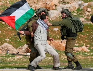 İsrail 12 Filistinli’yi gözaltına aldı