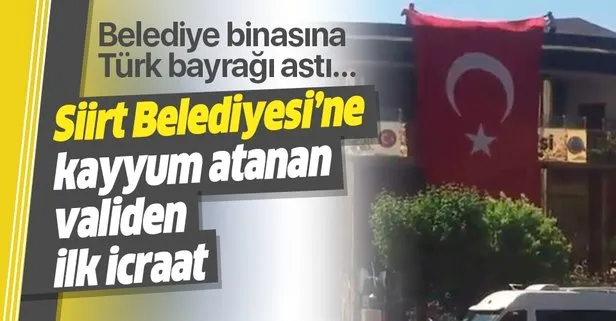 Siirt Belediyesi’ne kayyum atanan Vali Ali Fuat Atik’ten ilk icraat! Belediye binasına devasa Türk bayrağı astırdı