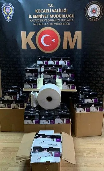 Koronavirüs fırsatçıları yakayı ele verdi! Kocaeli'de kaçak üretilen 9 bin 400 maske ele geçirildi-1