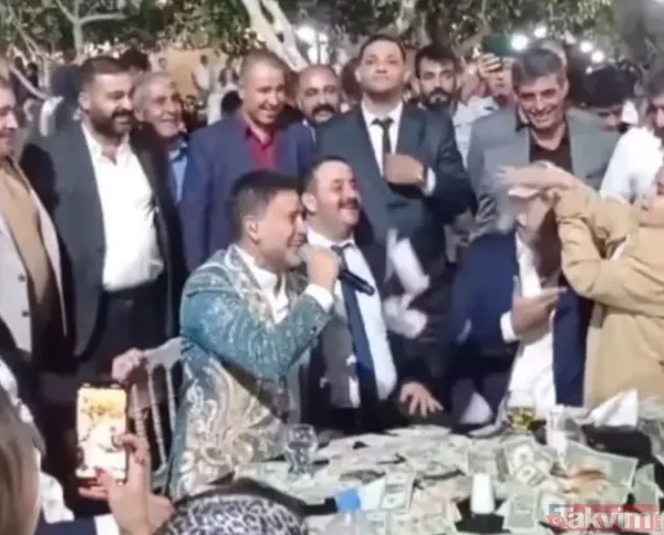Aşiret düğününde İzzet Yıldızhan'a dolar yağmuru! O anlar sosyal medyaya damga vurdu! Küçük çocuk deste deste yağdırdı - 6