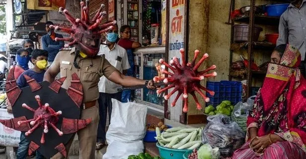Hindistan 1 milyar 300 milyonluk nüfusa sahip çıkamadı! Polis corona virüs kılığına girdi
