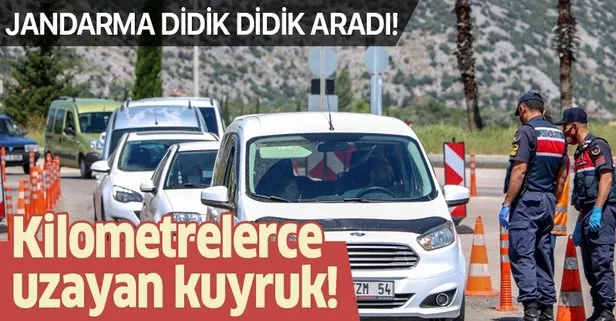 Sokağa çıkma kısıtlamasının ardından Antalya girişinde uzun araç kuyruğu