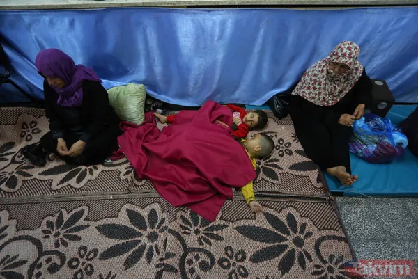 SON DAKİKA: Filistinli aileler çocuklarını İsrail bombalarından korumak için okullara sığındı - 1