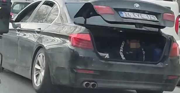 BMW’ye biniyor! Çocuğu arabanın bagajında taşıyor