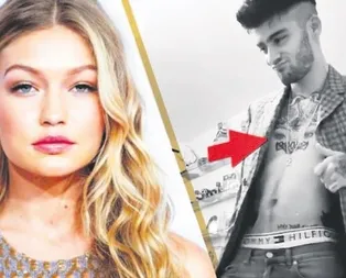 Gözlerini göğsüne kazıdı