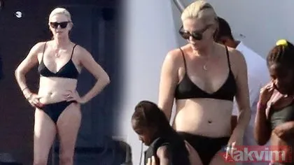 Charlize Theron yat gezisinde kural bozdu! Bikinili görüntülenen Hollywood yıldızı çocuklarıyla metrelerce yüksekten denize atladı