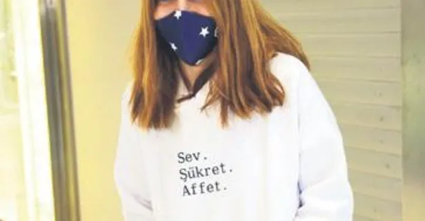 Nur Fettahoğlu'nun sloganı üstünde yazıyor