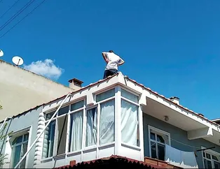 Anten ayarlamak için çıktı! Yan binanın çatısına düştü